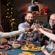 Family proposing christmas toast at festive dinner, clinking glasses - PhotoDune Item for Sale