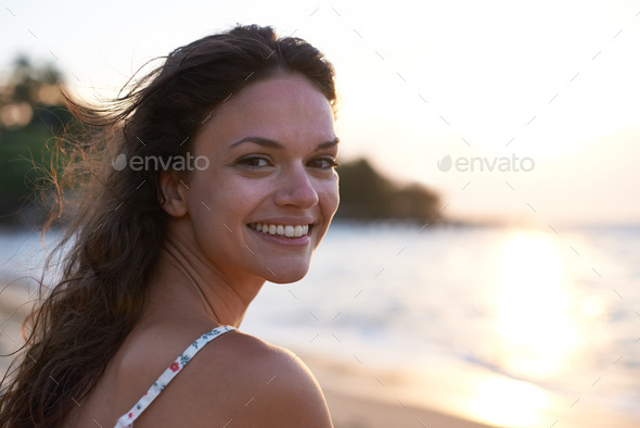 My happiest place. Portrait of a beautiful young woman on the beach.