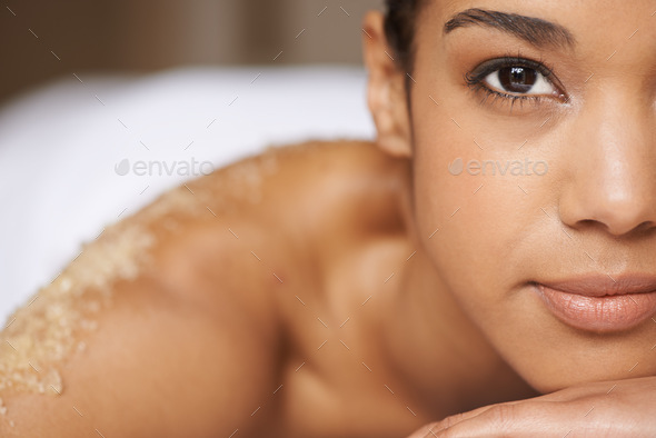 Total body exfoliation. Closeup shot of a young woman relaxing during a spa treatment.