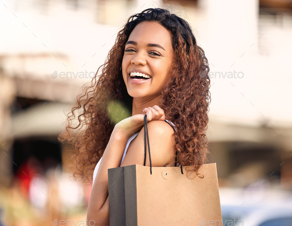 No better way to spend the way. Shot of a young woman enjoying a day of solo shopping.