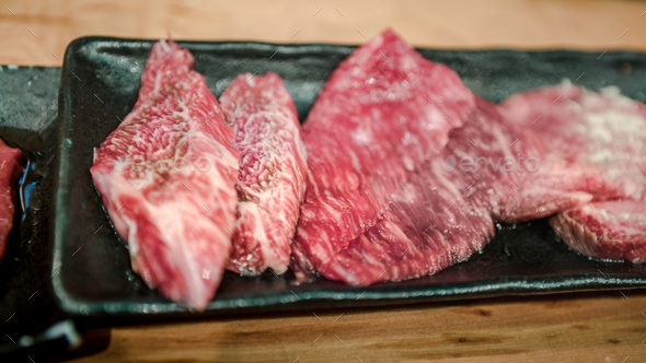 Wagyu beef raw sliced served for japanese barbecue of Sukiyaki ...