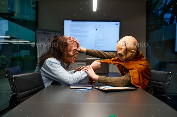 Zombie businessmen fighting in corporate office Stock Photo by NomadSoul1
