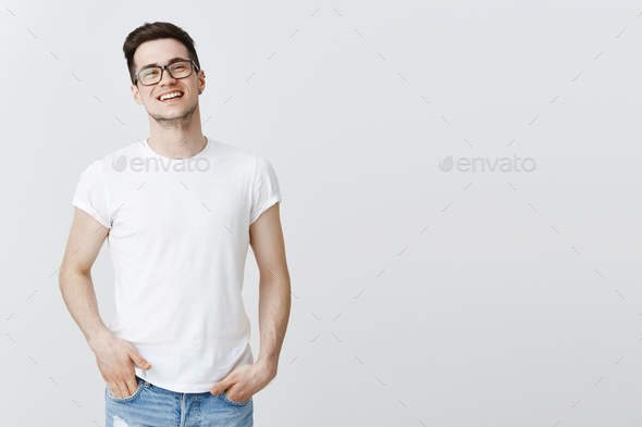 Successful pleased european IT guy celebrating signing good deal with investors, standing proudly