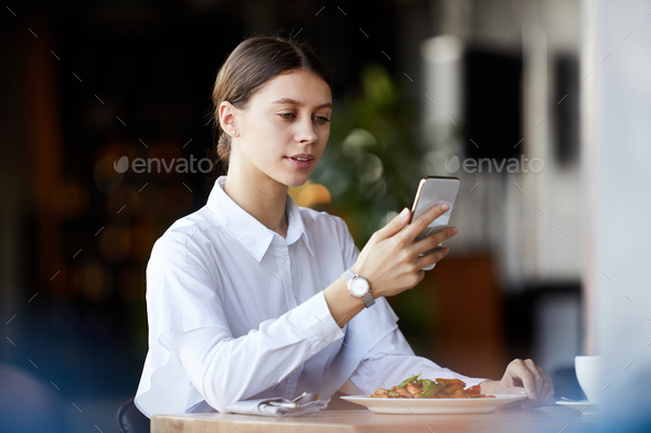 Lady having business lunch in restaurant - Stock Photo - Images