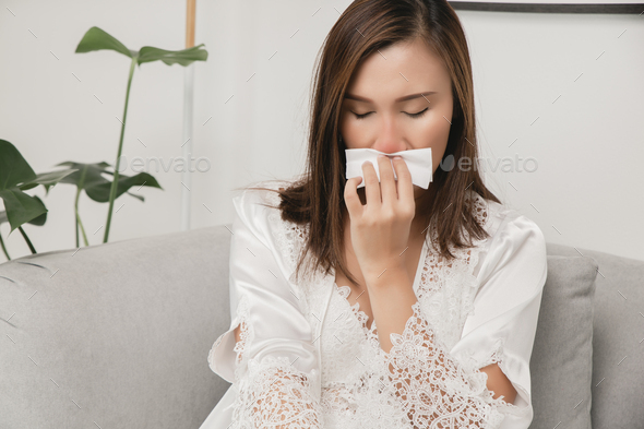 Symptoms of allergic rhinitis in women - Stock Photo - Images