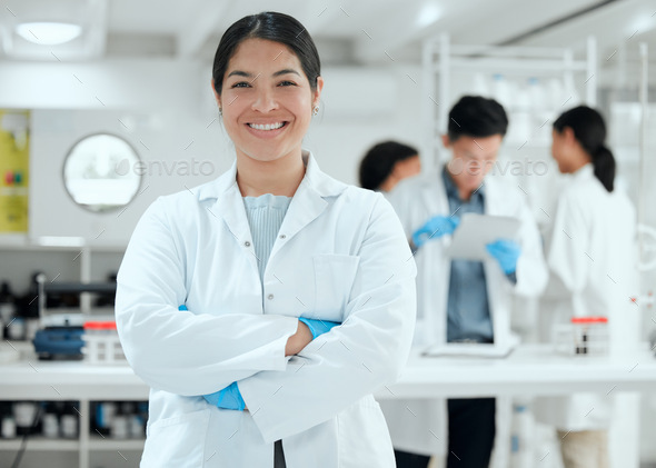 Cant wait to get started. Shot of a young female scientist standing proudly in her lab.
