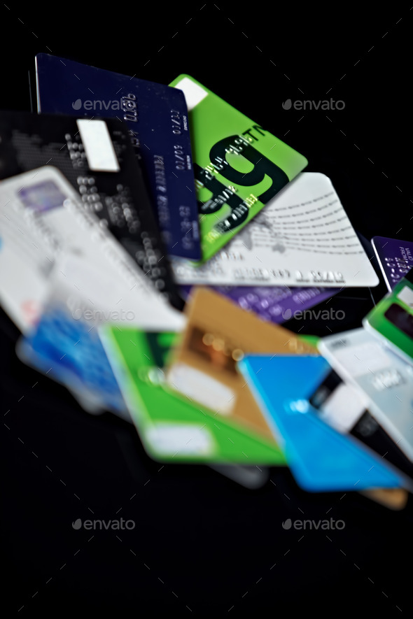 Give credit where credit is due. Shot of a pile of credit cards. - Stock Photo - Images