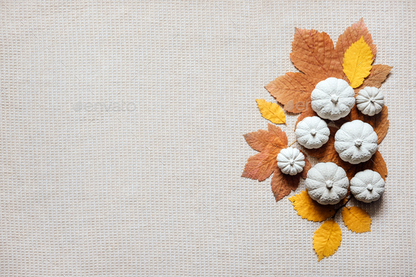 Autumn creative craft background with decorative clay pumpkins and wooden  autumn leaves. Decorative Stock Photo by IrynaKhabliuk