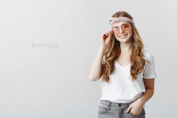 Hippies still among us. Portrait of attractive stylish young woman in trendy sunglasses and head