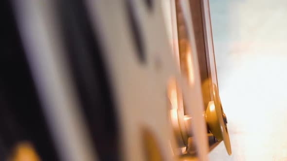 Film Reel with Pictures in Old Equipment in Projection Booth alt