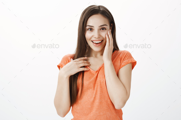 Have you heard last rumor. Portrait of energetic excited attractive woman, smiling broadly, covering