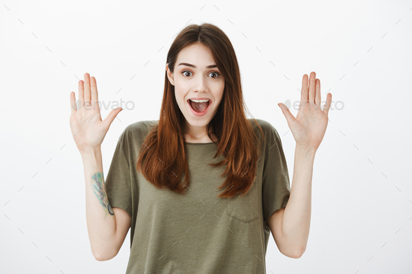Girl waiting for high five after receiving good news about successful finish of project. Positive