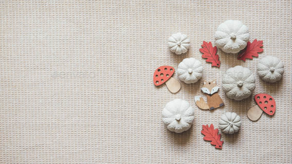 Autumn creative craft background web banner with decorative clay pumpkins  and wooden autumn leaves Stock Photo by IrynaKhabliuk