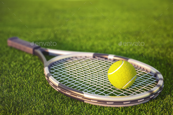 Tennis racket and tennis ball on a grass of tennis court. - Stock Photo - Images