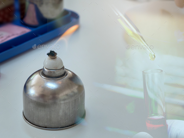 Alcohol burner and  test tube in rack,science laboratory research and development concept - Stock Photo - Images