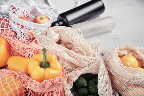 Fresh vegetables and fruits in eco bags, reusable water bottles. Zero waste shopping