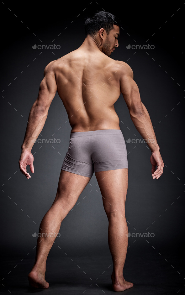 Full Length Shot Of A Babe Man Standing Alone And Posing Shirtless In The Studio Stock Photo By