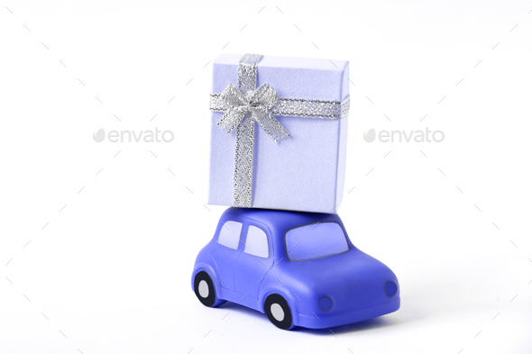 Insulated rubber gift delivery machine for toys with blue gift up. The concept of gift delivery