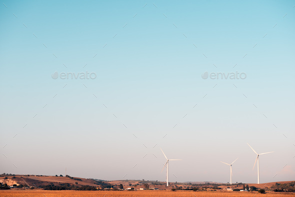 windmills between crop fields, wind energy