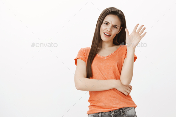 Leave me alone. Portrait of displeased popular caucasian female model in casual outfit, making get
