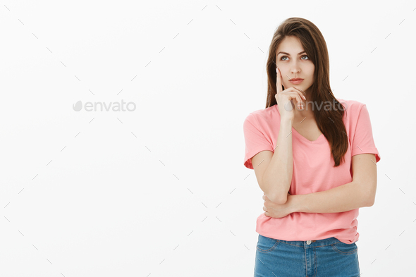 Girl visiting art museum having no clue what painting mean. Dreamy attractive and confident young wo - Stock Photo - Images
