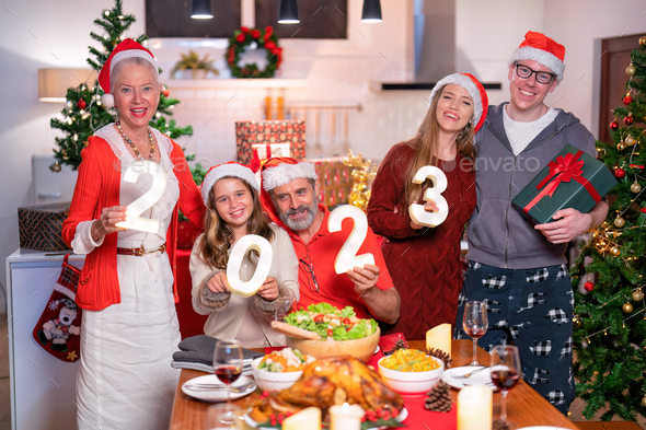 American family happy laughing celebrate christmas eve - Stock Photo - Images