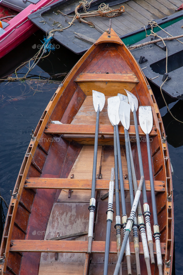 Wooden rowing boat for hire moored on the River Thames London England