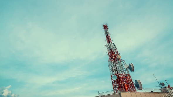 Time Lapse of Telecommunication Tower Against Sky and Clouds in Background alt