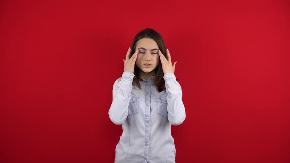 The Young Woman's Eyes Hurt She Massages Them with Her Hands alt