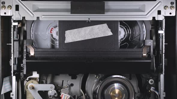 VHS cassette insert in VCR, play from beginning, then eject at the end of tape alt