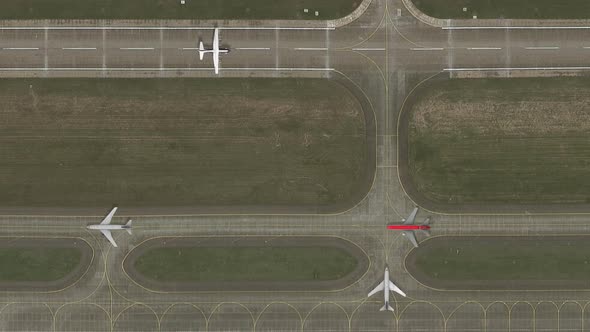 Passenger Planes are Moving Along the Runway alt