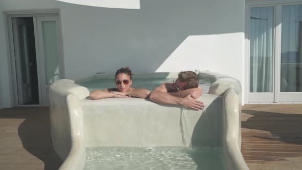 Couple Relaxing in Private Whirlpool