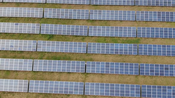 Solar Panels Quadrocopter Flight Low Over the Field