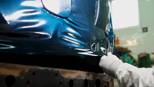 Worker at the Service Station is Further Processed Edge Vinyl By Special Dryer alt