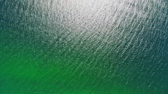 One Boat in the Turquoise Sea During Day Overhead View