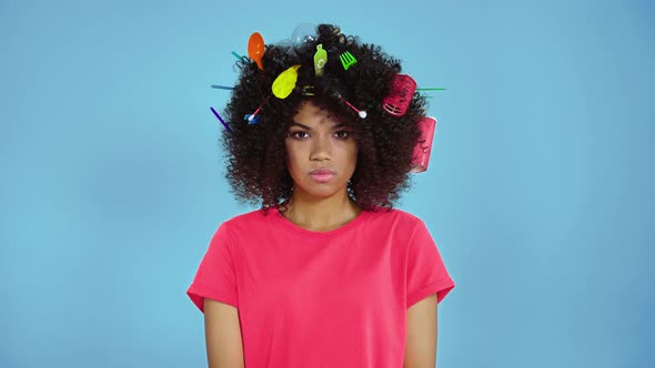 Woman with different trash in her hair.