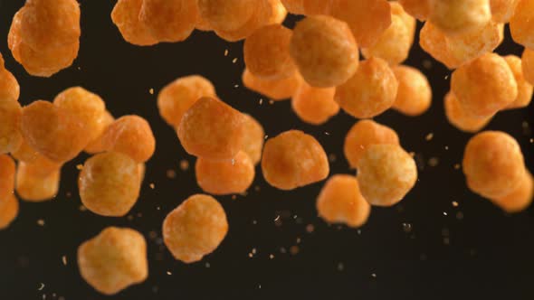 Cheese puffs in super slow motion.  Shot on Phantom Flex 4K high speed camera.