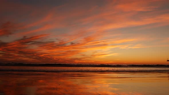 California Summertime Beach Aesthetic, Golden Sunset. Vivid Dramatic Clouds Over Pacific Ocean Waves