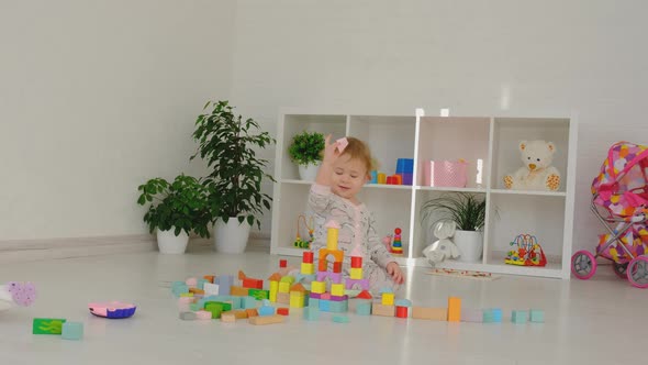The Child Plays with Toys in the Room alt