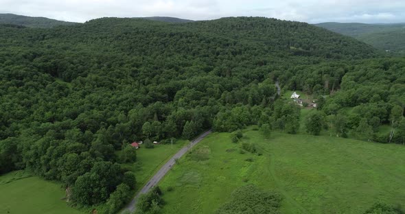 A drone pan from right to left over the epic scenery of the old round Catskill Mountains in upstate alt