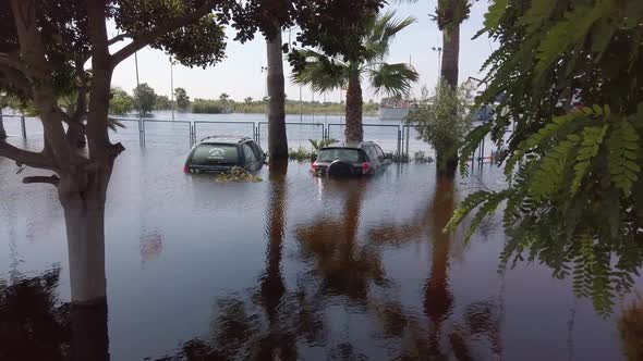 Flooded Cars in the Parking Road. Deep Waters. Flooding Nature After Heavy Rainy Day. alt