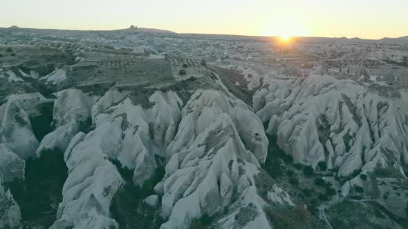 Sunset in cappadocia red valley landscape with horse riders alt