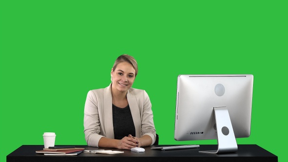 Young woman beauty looking and smiling to camera on a Green alt