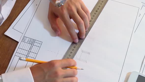 Engineer Working On Drawing