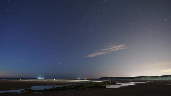moving stars on night sky at british chanal near Calais with wreck of german ww1 submarine SM UC 61 alt