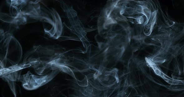 Smoke of Cigarette rising against Black Background, Slow Motion 4K alt