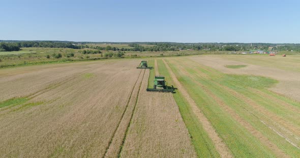 Combine Harvester on Wheat Field alt