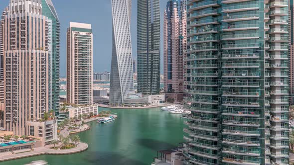 Aerial View of Dubai Marina Residential and Office Skyscrapers with Waterfront Timelapse alt