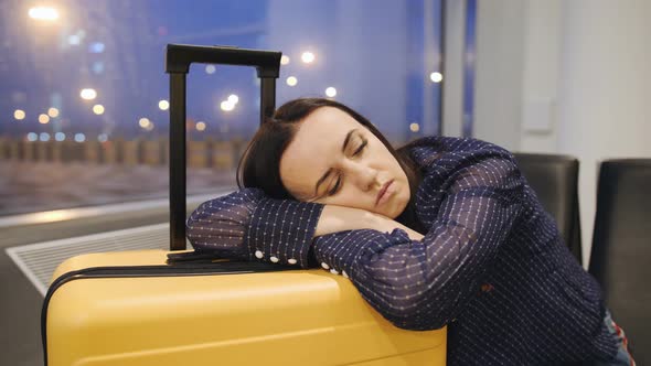 Businesswoman Sleep on the Wait Area at the Airport