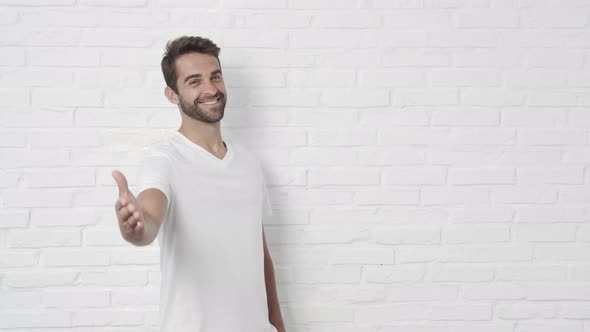 Happy Guy Greeting With Hand